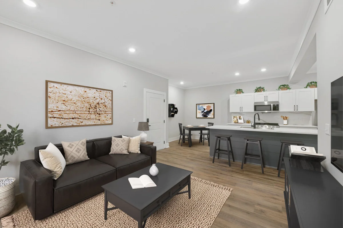 Open-plan living room and kitchen inside a two-bedroom Pointe Grand apartment